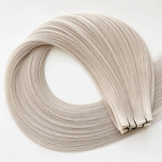 “Platinum blonde seamless weft hair extensions – Solace Seamless®”