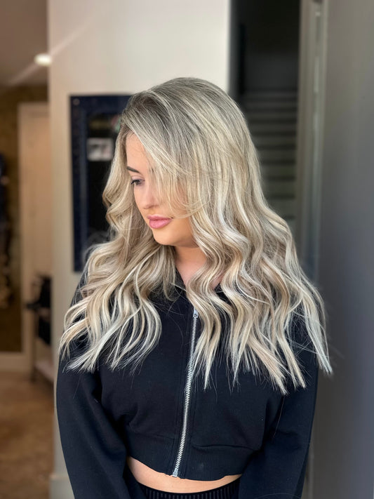 “Stylist hair transformation using seamless weft extensions for volume and length”
